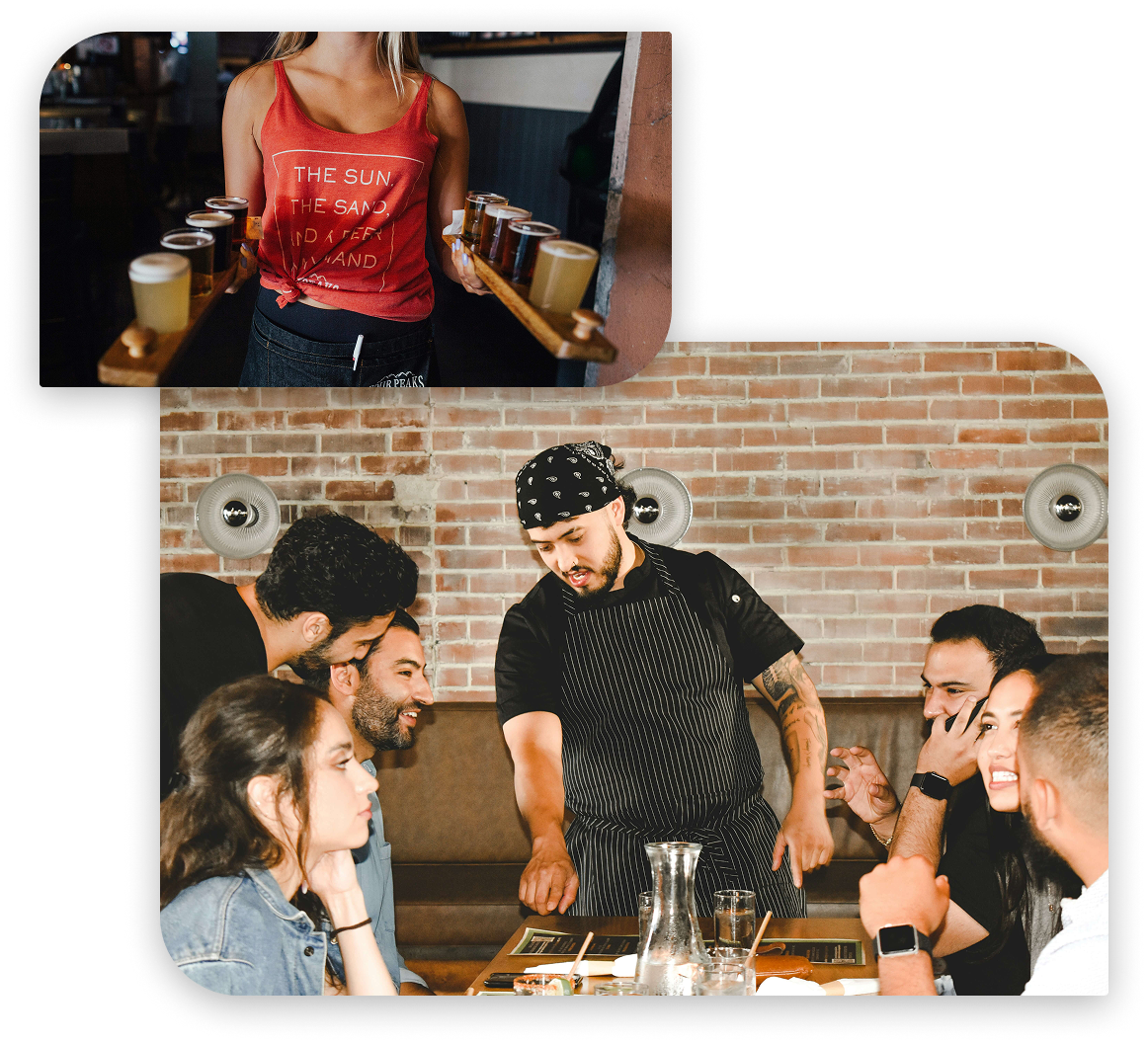 A waitress carying beer and chef talking to table
